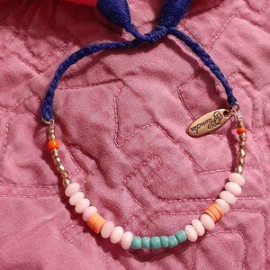 Beaded and tasseled bracelet